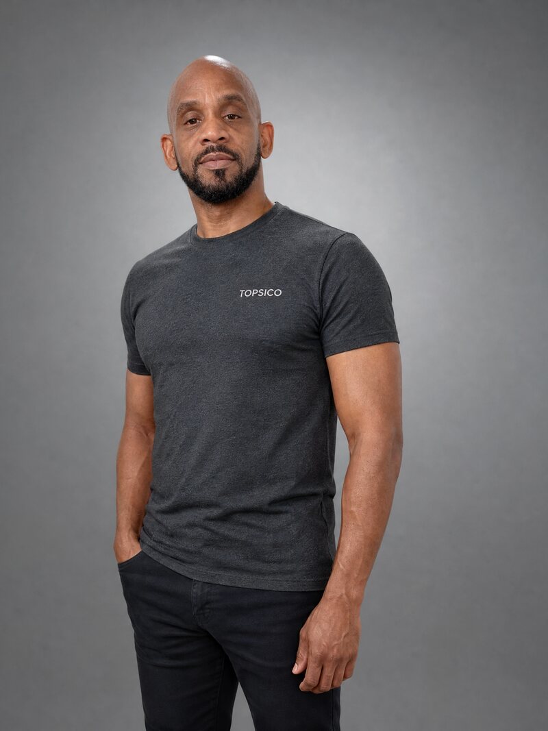 Torian of TOPSICO LLC, wearing a dark grey TOPSICO shirt.